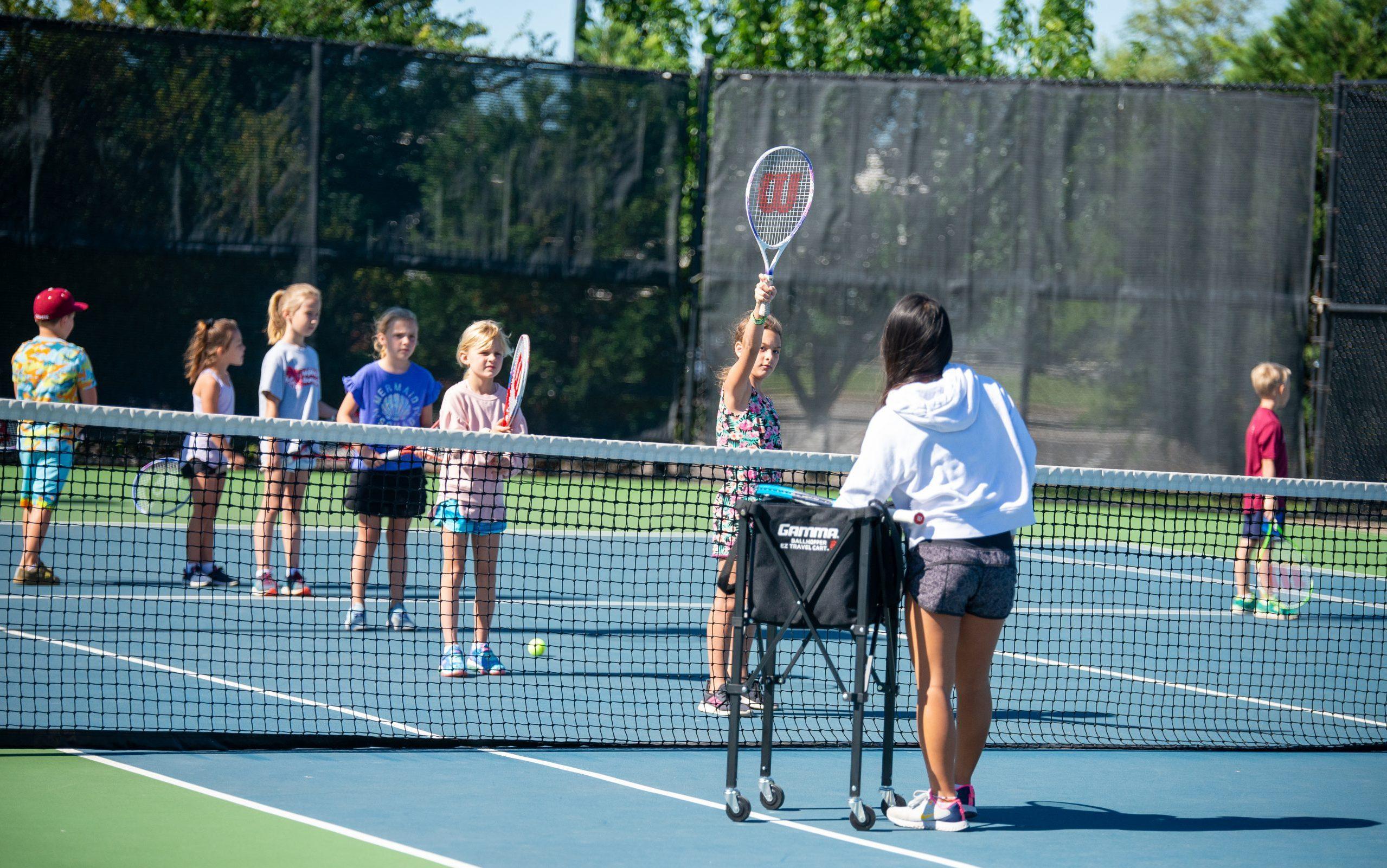 Junior tennis class on court